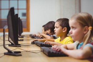 children learning to program on computers