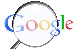Magnifying glass on google logo