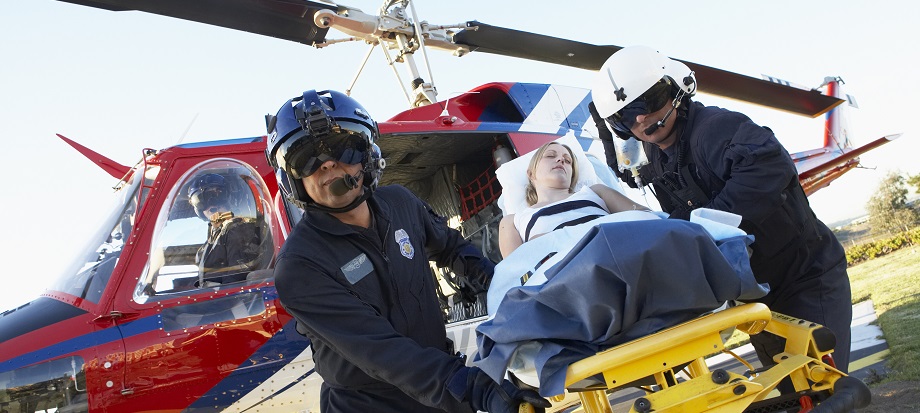 paramedics with a patient on a stretcher
